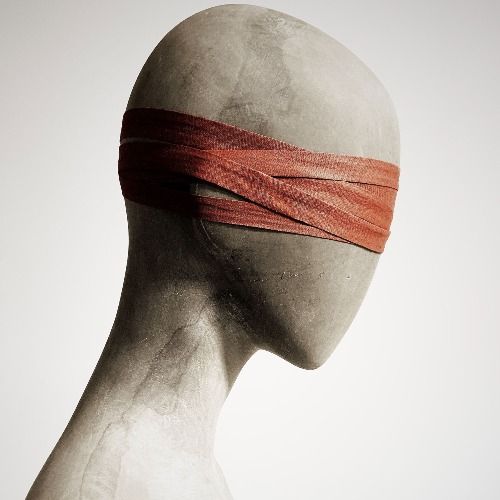 A blindfolded wooden dummy